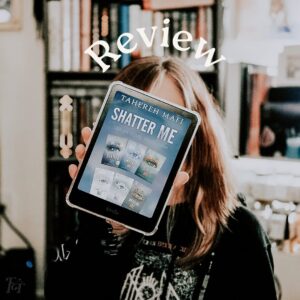 Person holding a Kindle showing the Shatter Me series collection in front of a bookshelf for my Shatter Me series review.